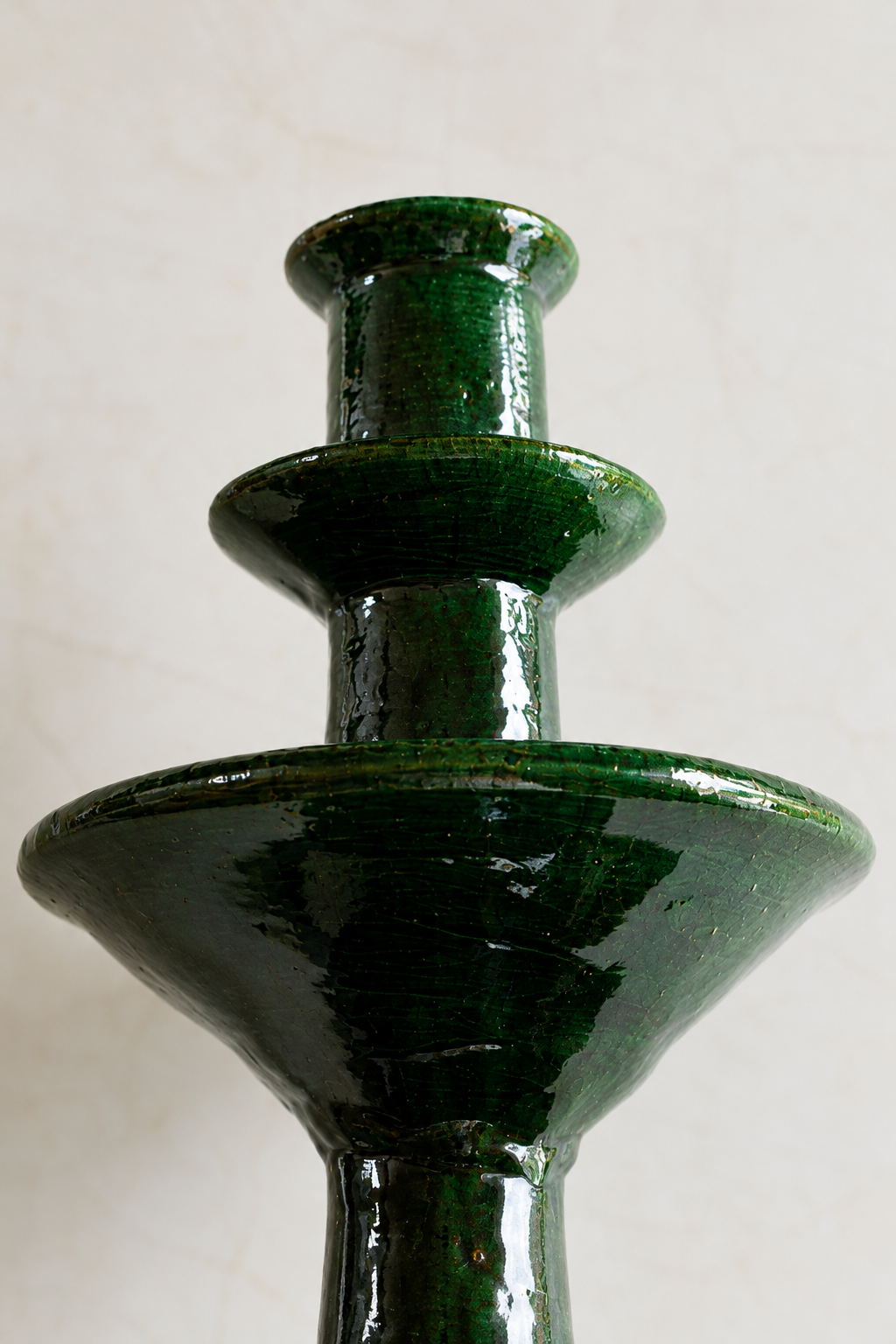 Glossy emerald green ceramic candelabra with three rings, decorative home decor by Embajada Craft.