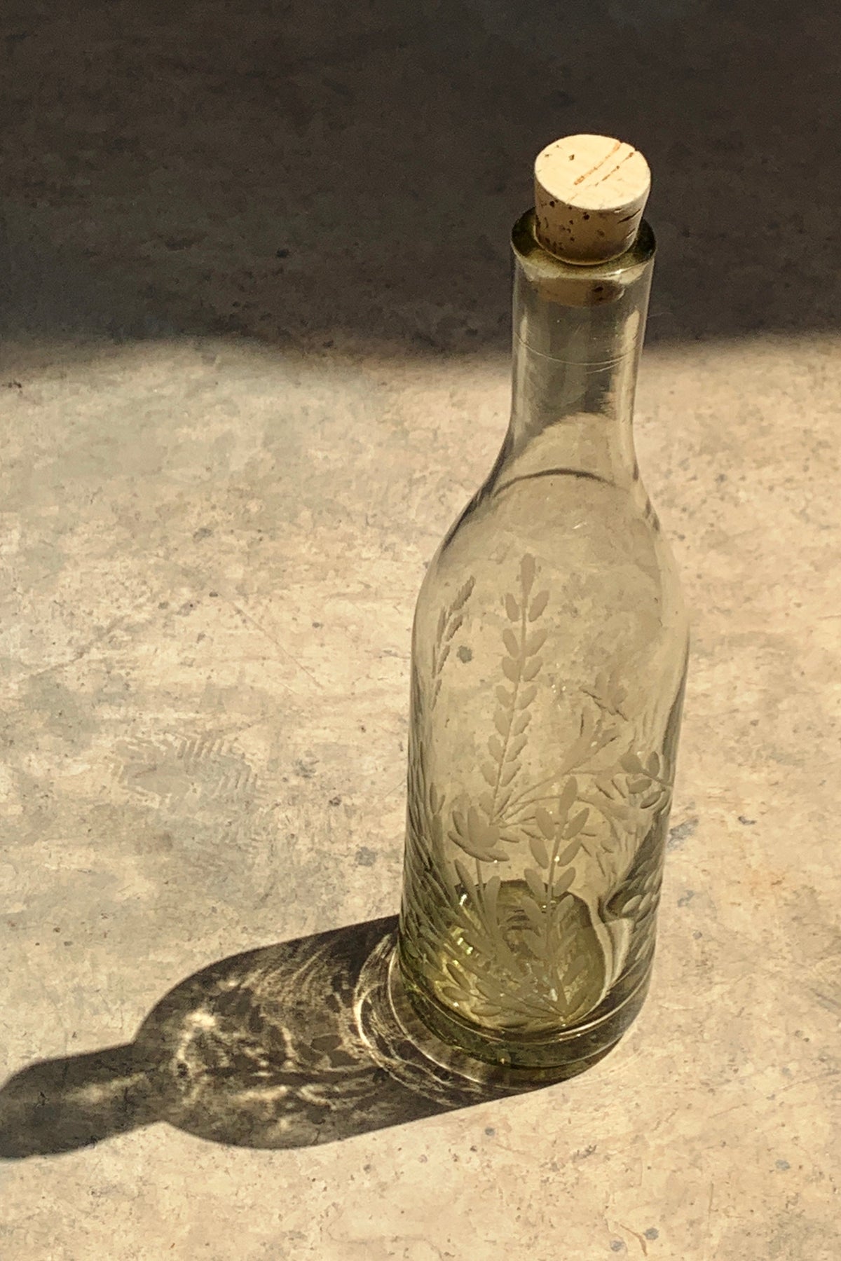 Hand blown glass bottle with Pepita engraving, decorative home decor piece by Embajada Craft