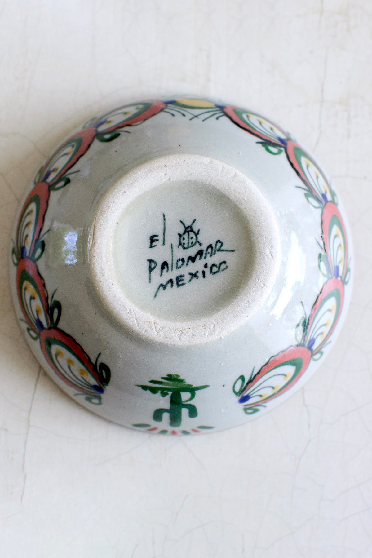 Colorful exterior-painted dessert bowl by Embajada Craft, showcasing vibrant design and smooth ceramic surface for elegant tableware.