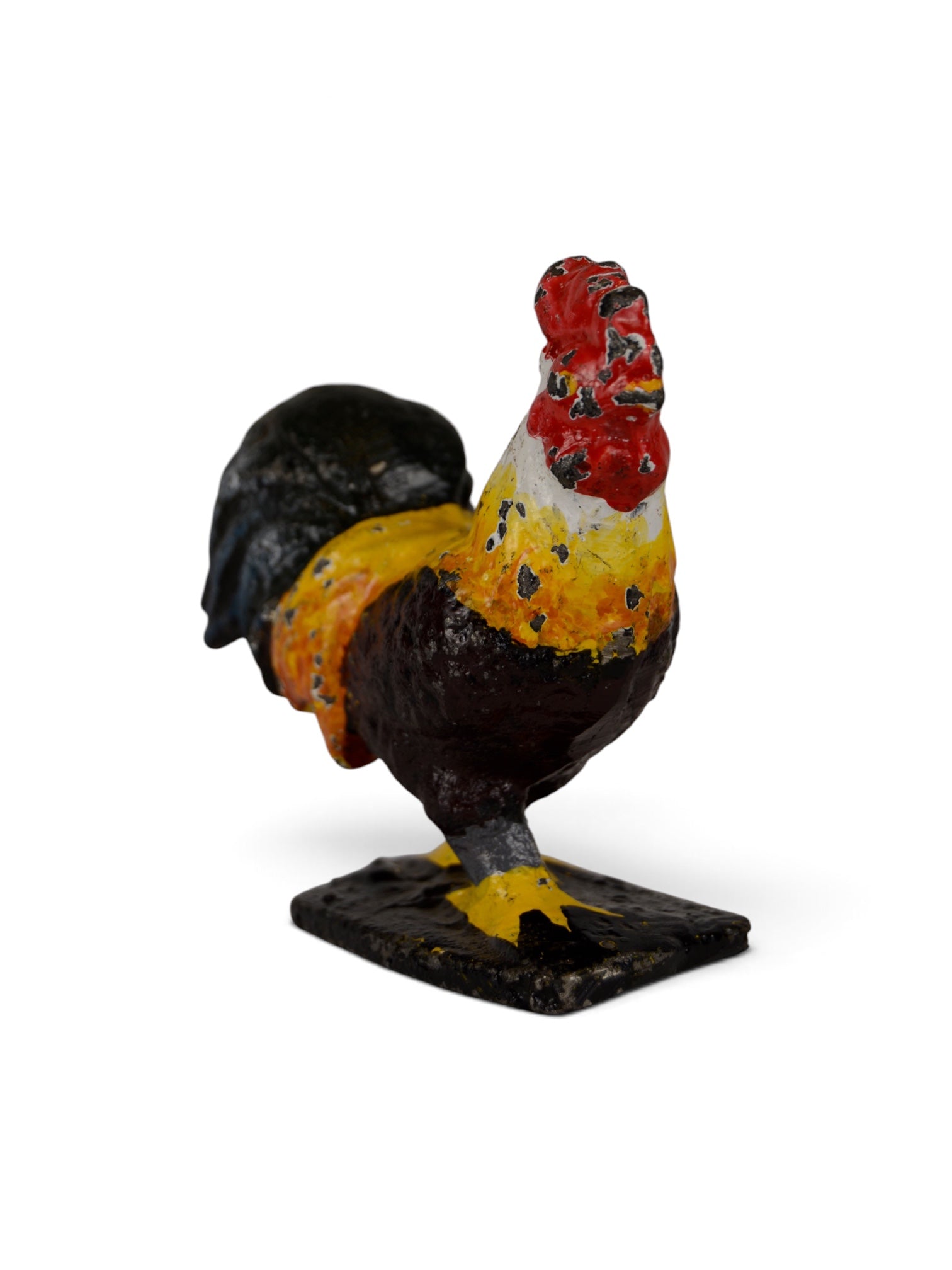 Colorful polychrome iron rooster sculpture for home decor, crafted by Embajada Vintage.