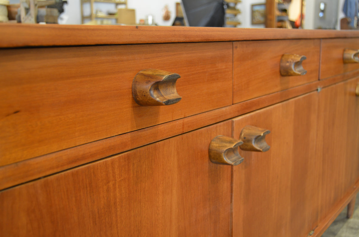 Long Mexican Mid-Century Wood Credenza by Embajada Vintage, showcasing sleek wooden furniture with clean lines and vintage design.