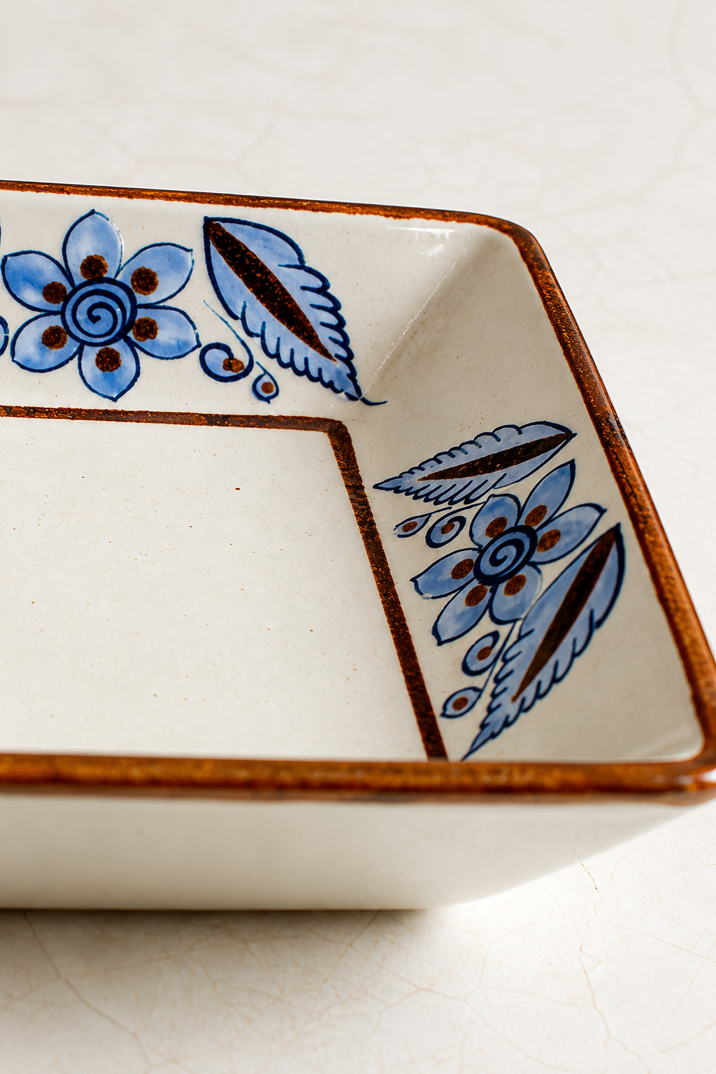 Hand-painted blue floral ceramic dish from El Palomar Rectangular Tonalá serving bird tray by Embajada Craft, ideal for tableware displays.