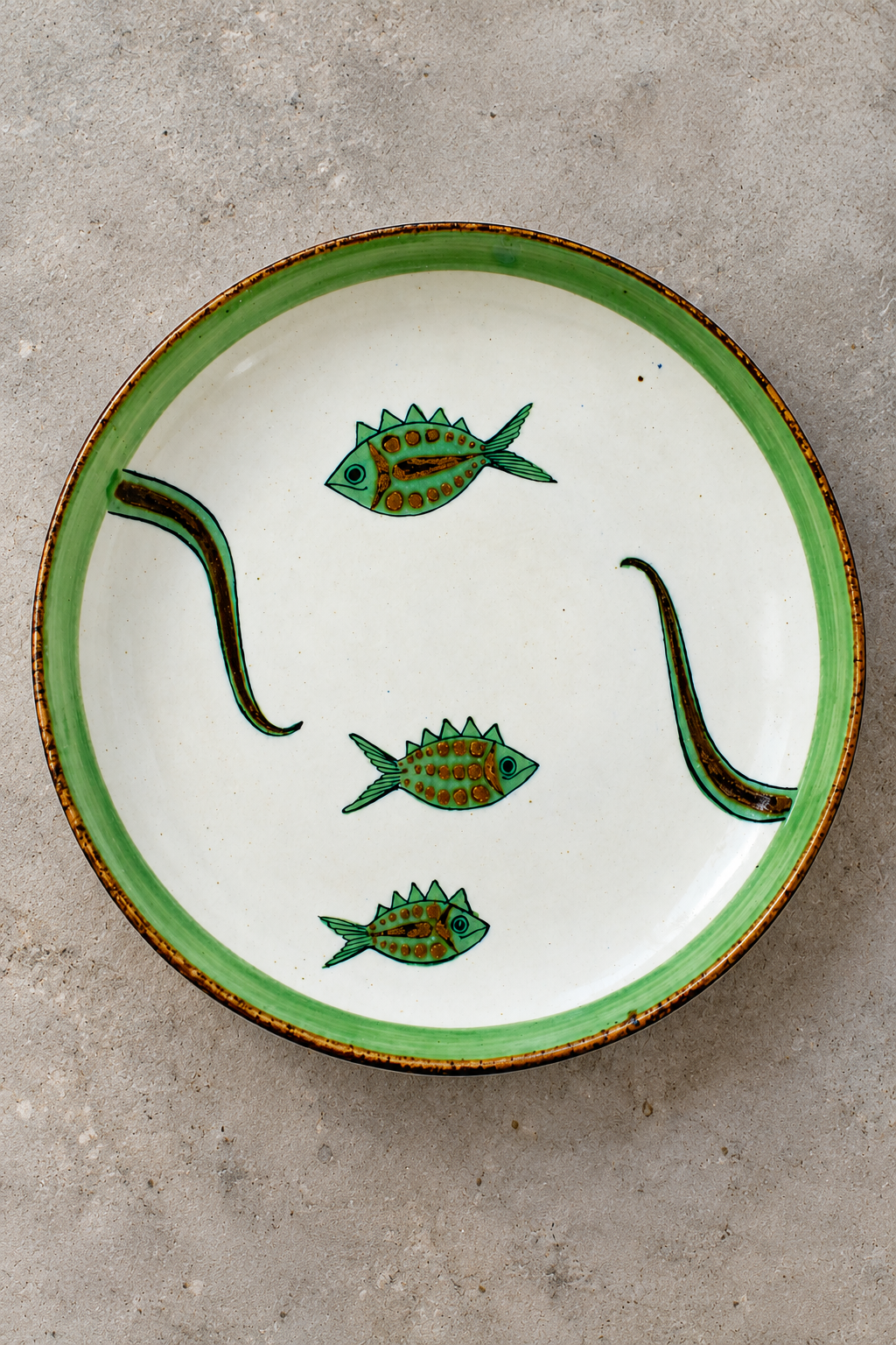 Hand-painted ceramic fish plate from Embajada Craft, decorative tableware with detailed fish design.