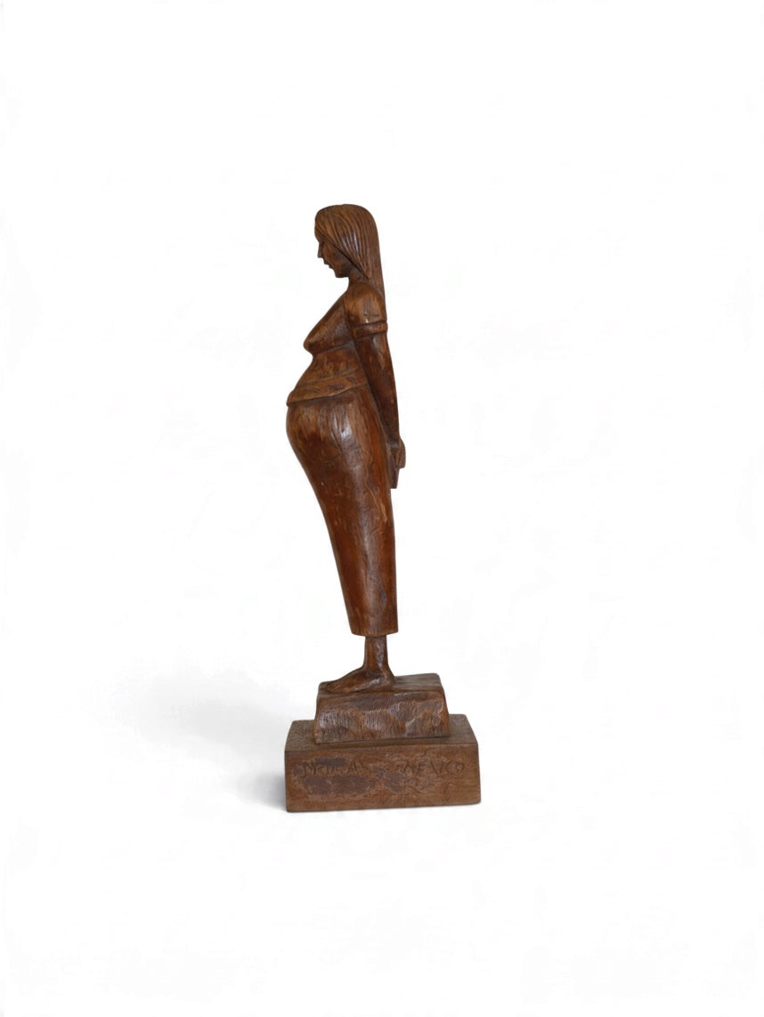 Carved wooden mother sculpture from Embajada Vintage, detailed home decor art piece with intricate craftsmanship.