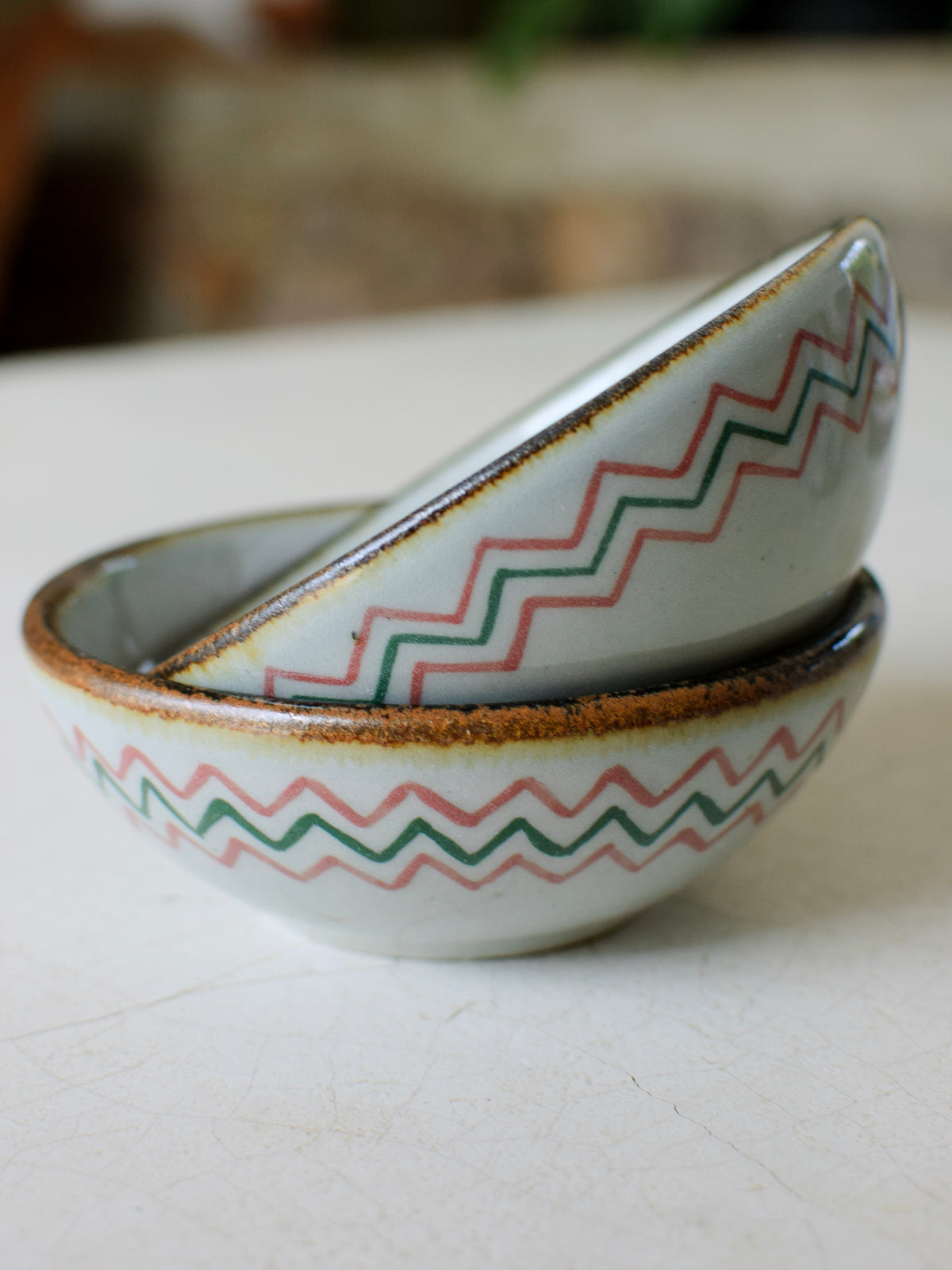 Stacked cactus-shaped dessert bowls from El Palomar by Embajada Craft, showcasing colorful ceramic tableware for desserts.