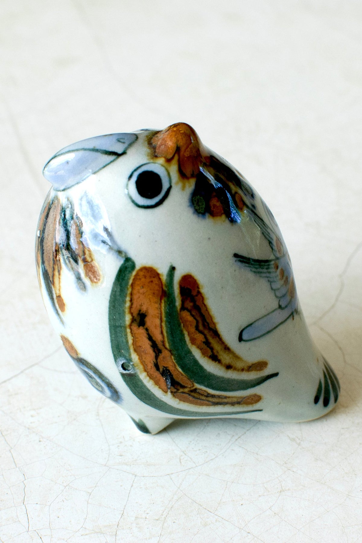 Colorful El Palomar Parrot home decor piece by Embajada Craft, featuring vibrant feathers and detailed craftsmanship.