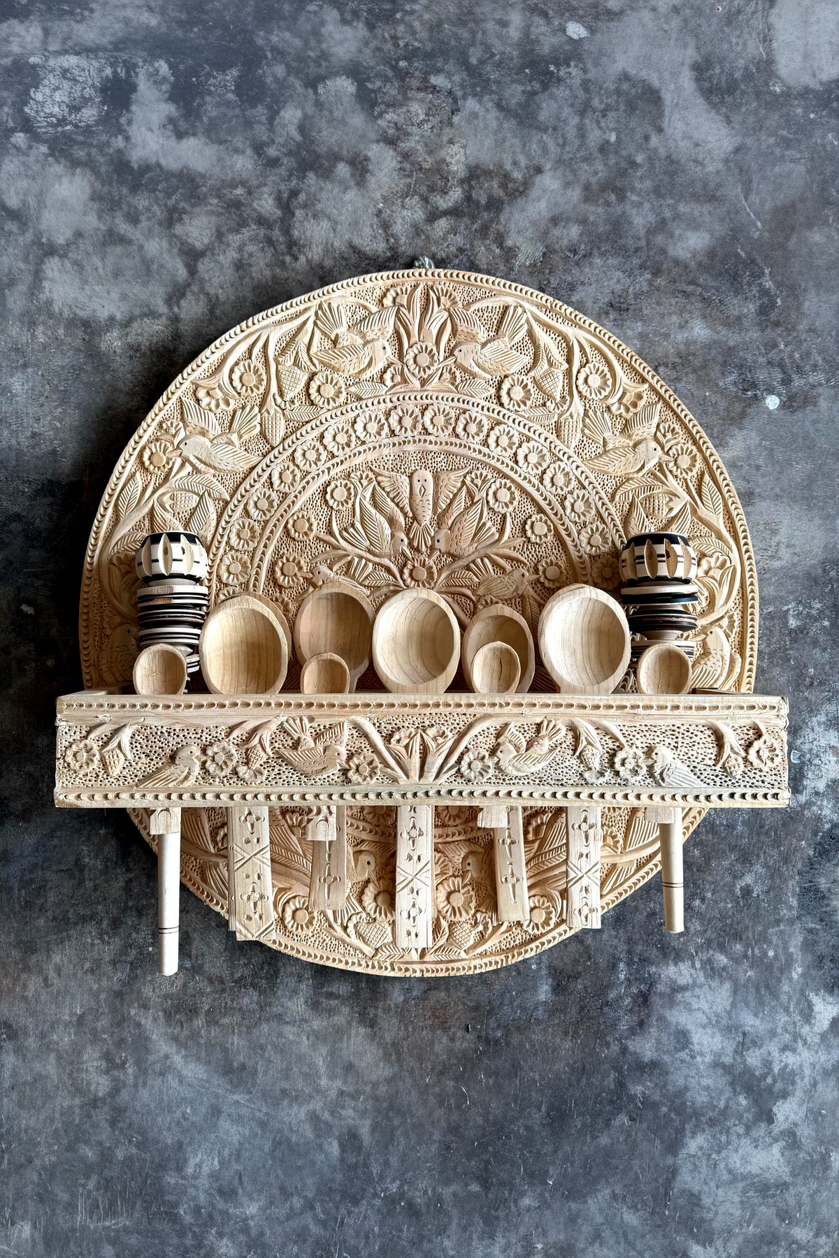 Hand-carved 15-piece wooden trastero from Cuanajo, crafted by La Embajada, showcasing intricate traditional home decor.